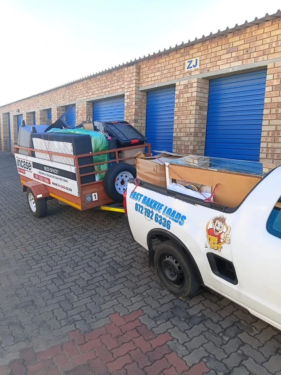 White bakkie towing a loaded trailer — FAST BAKKIE LOADS