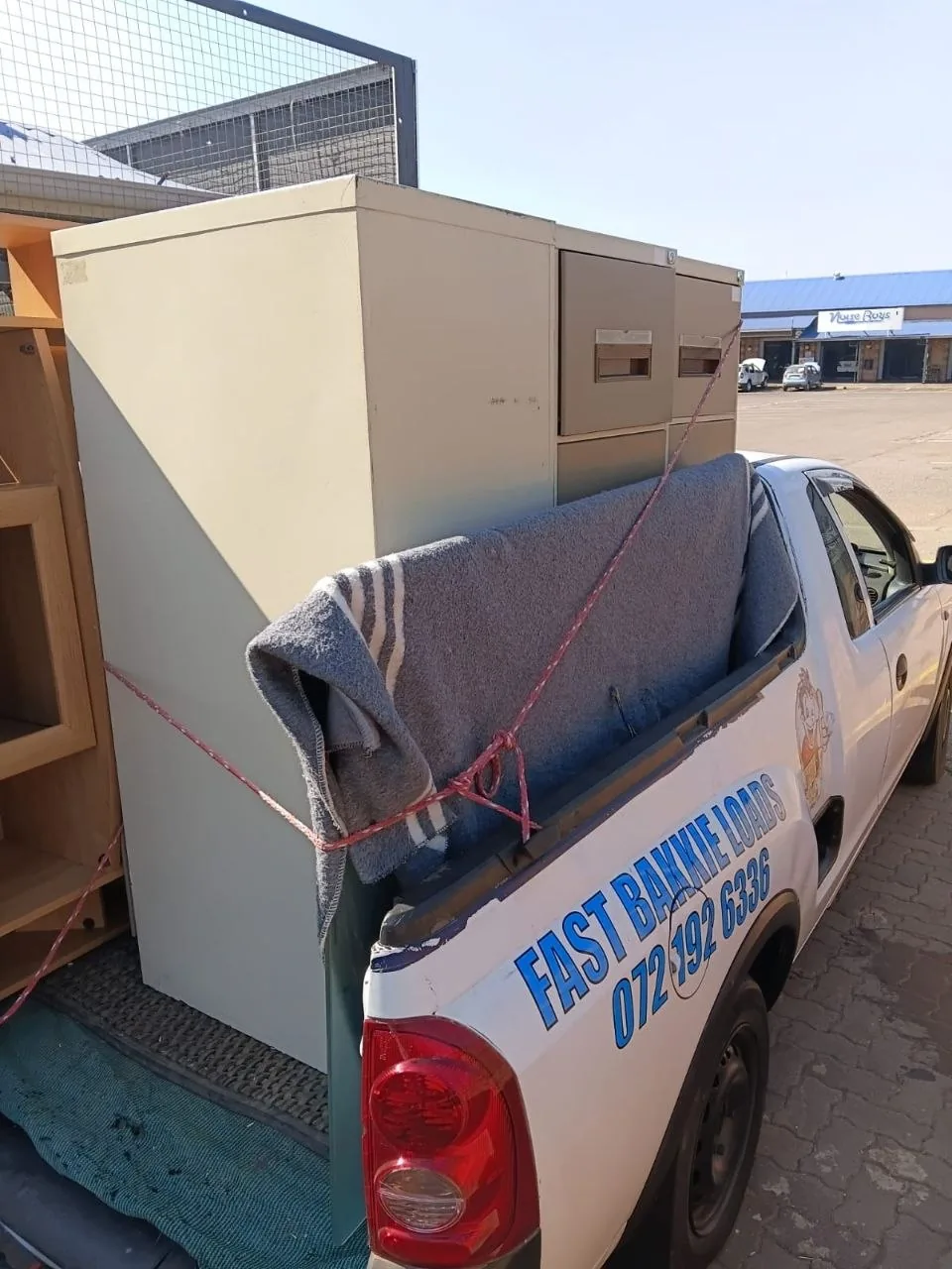 Filing cabinet loaded on bakkie, Village Plaza