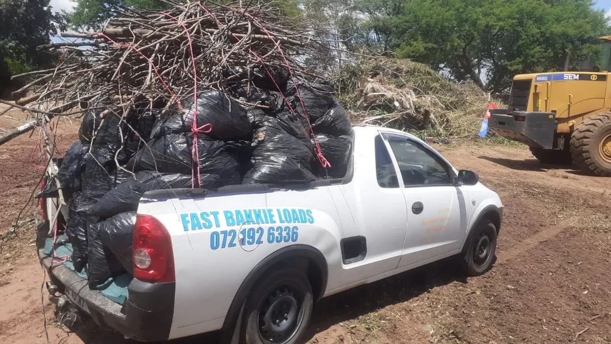 White bakkie loaded with garden waste — FAST BAKKIE LOADS branding