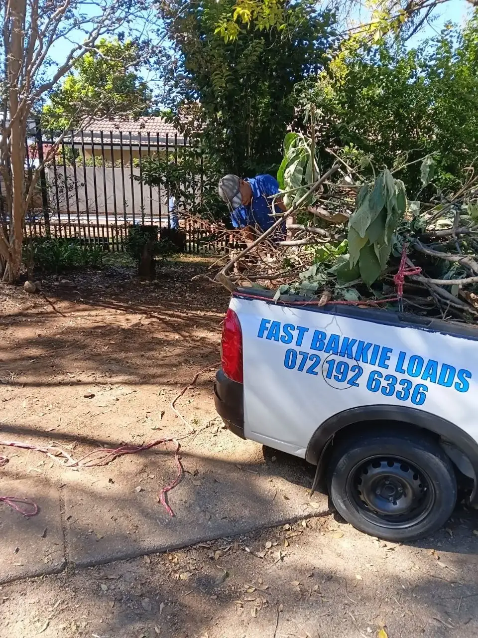 Garden waste being loaded by hand