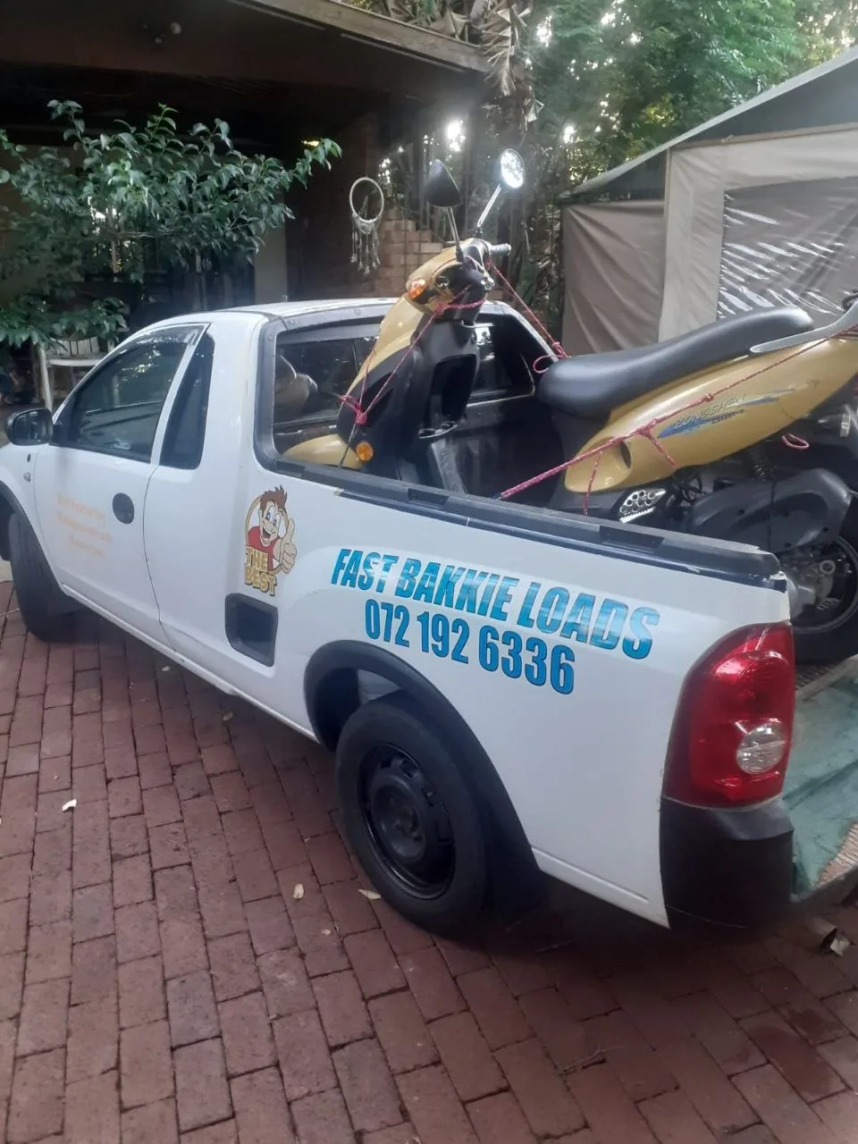 Scooter tied down in bakkie bed